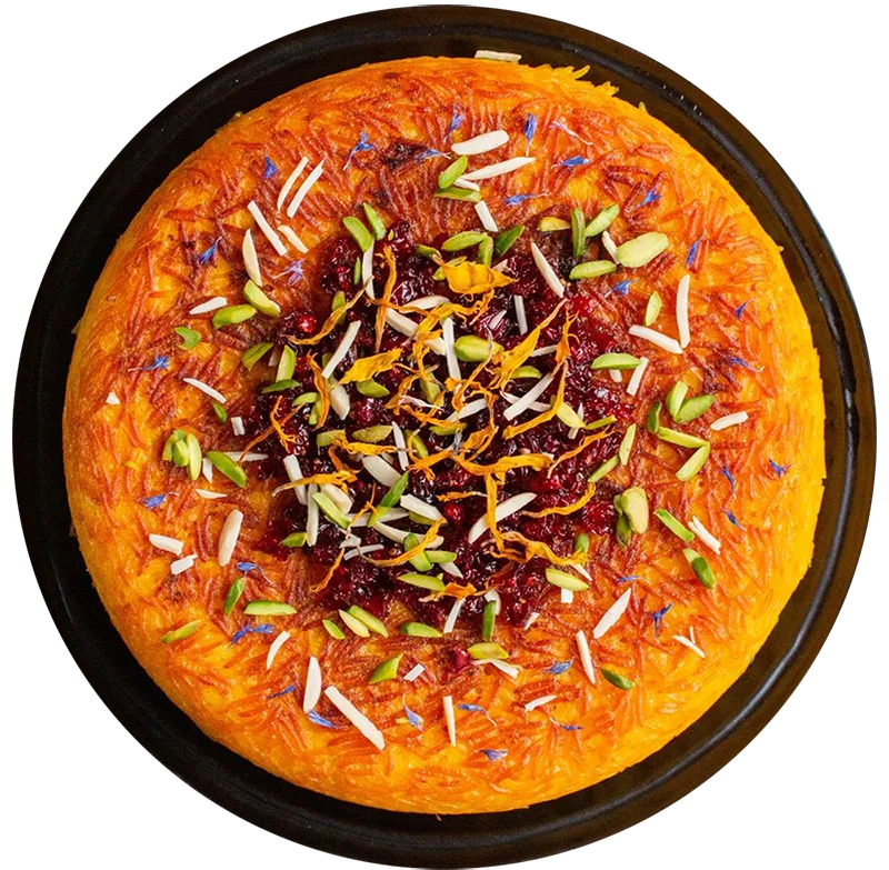 Tahdig fra KUKU Iranian Kitchen &ndash; spr&oslash;d iransk risret med safran, pistacien&oslash;dder og b&aelig;r.